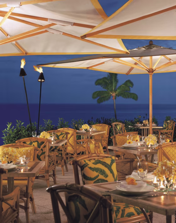 A stunningly beautiful property all around, the Four Seasons The Lodge at Koele-One Keomoku Highway in Hawaii has a poolside dining area that is a perfect place to unwind after a day on the golf course.